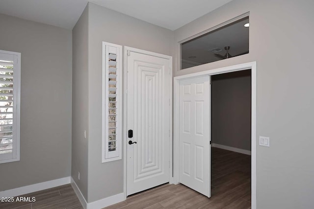 entrance foyer with wood finished floors and baseboards