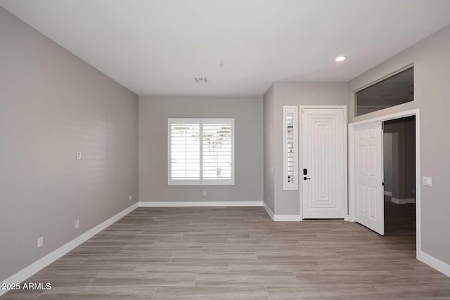 interior space with recessed lighting, visible vents, baseboards, and light wood-style floors
