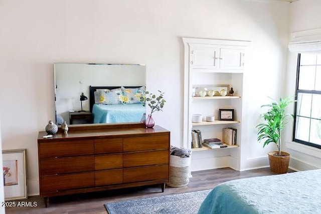 bedroom with wood finished floors