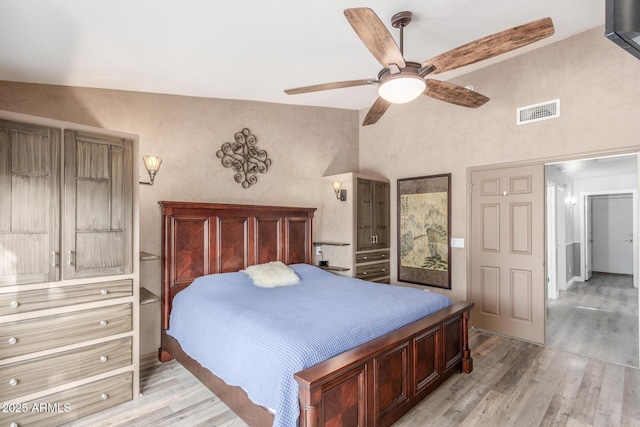 6918 W Villa Hermosa W, Glendale, AZ 85310 - bedroom with light wood finished floors, a ceiling fan, and high vaulted ceiling