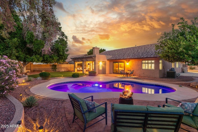 6918 W Villa Hermosa W, Glendale, AZ 85310 - view of swimming pool featuring a patio area and an outdoor living space with a fire pit