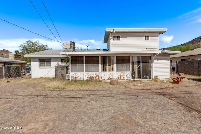 9408 N 15th St, Phoenix, AZ 85020 - rear view of house featuring a sunroom and central air condition unit