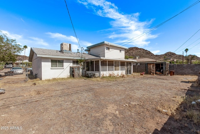 9408 N 15th St, Phoenix, AZ 85020 - rear view of house with a sunroom, central AC unit, and a mountain view