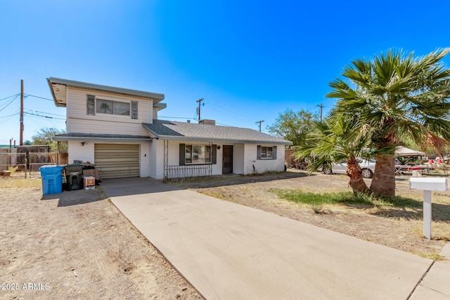 9408 N 15th St, Phoenix, AZ 85020 - view of front of property with a porch, driveway, and an attached garage