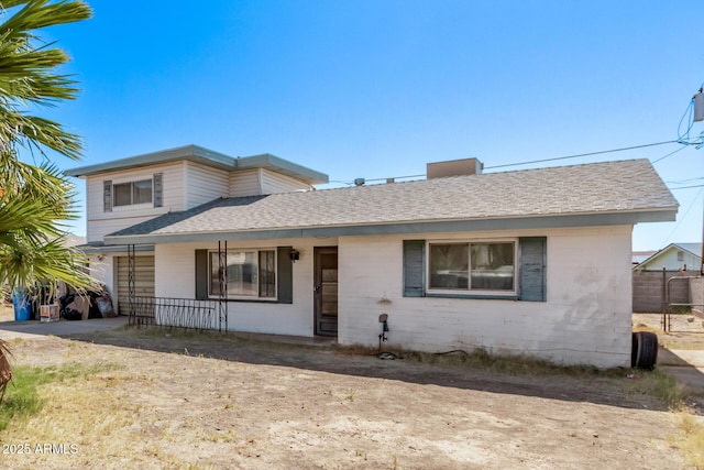 9408 N 15th St, Phoenix, AZ 85020 - view of front of home with covered porch, roof with shingles, driveway, and an attached garage