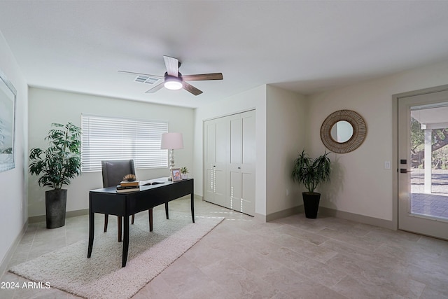 office space featuring plenty of natural light and ceiling fan