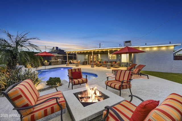 4610 N 14th Ave, Phoenix, AZ 85013 - view of swimming pool with an outdoor living space with a fire pit and a patio area