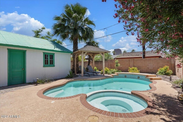 view of pool with a gazebo, a patio, a fenced backyard, and a pool with connected hot tub