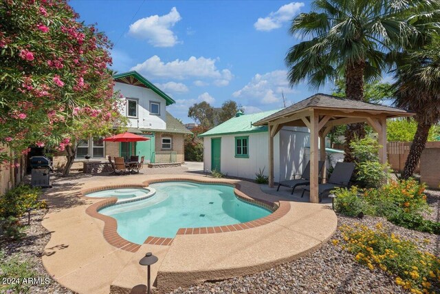 view of pool featuring a gazebo and a patio