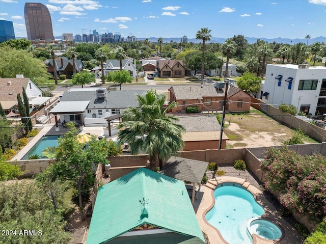 birds eye view of property with a city view