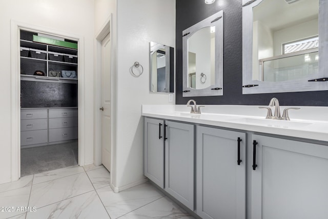 bathroom featuring vanity and a shower with shower door