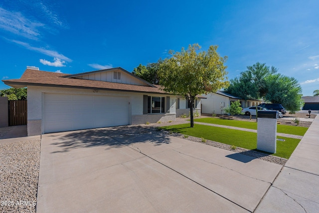 ranch-style home with a garage and a front yard