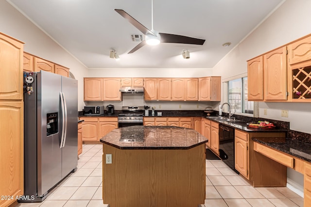 kitchen featuring stainless steel appliances, sink, light brown cabinets, and a center island