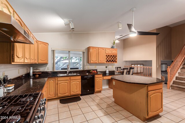 kitchen with sink, light tile patterned floors, a center island, high end range, and black dishwasher