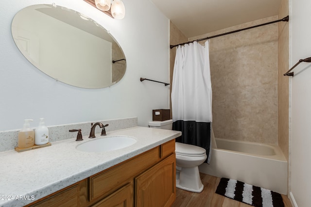 full bathroom with toilet, shower / bath combo, vanity, and wood-type flooring