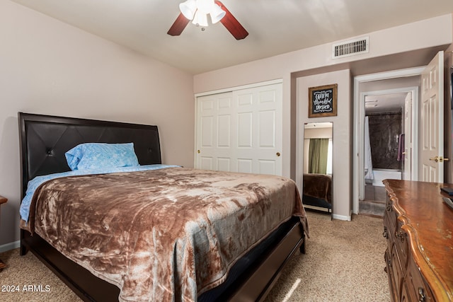 carpeted bedroom with a closet and ceiling fan