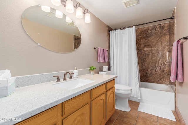 full bathroom with vanity, shower / bath combo, tile patterned floors, and toilet