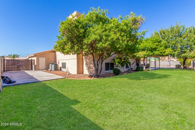 view of yard featuring central AC unit and a patio area