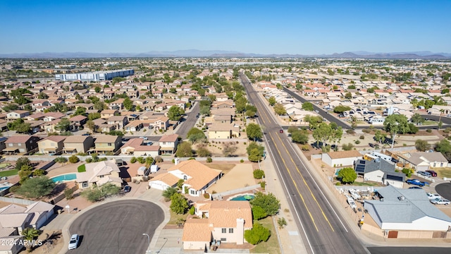 birds eye view of property with a mountain view