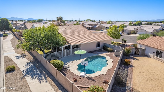 view of pool featuring a mountain view and a patio area