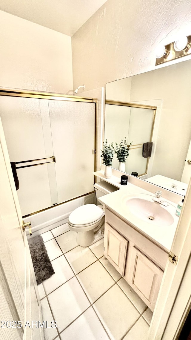 11854 E Carol Ave, Scottsdale, AZ 85259 - bathroom featuring vanity, tile patterned flooring, and shower / bath combination with glass door