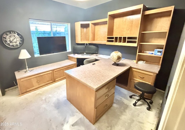 11854 E Carol Ave, Scottsdale, AZ 85259 - home office featuring built in desk and unfinished concrete floors