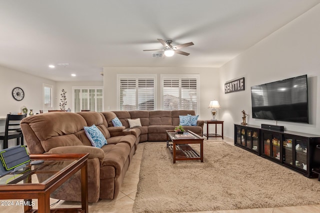 living room with light tile patterned floors and ceiling fan