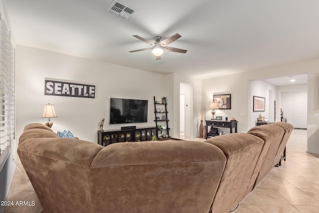 tiled living room featuring ceiling fan