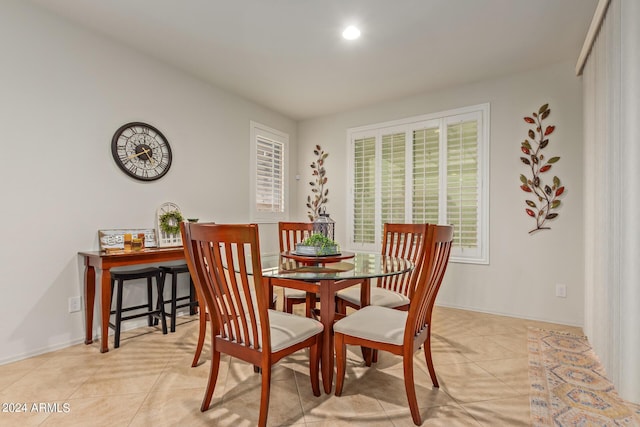 dining room with light tile patterned flooring