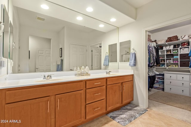 bathroom with vanity and tile patterned flooring