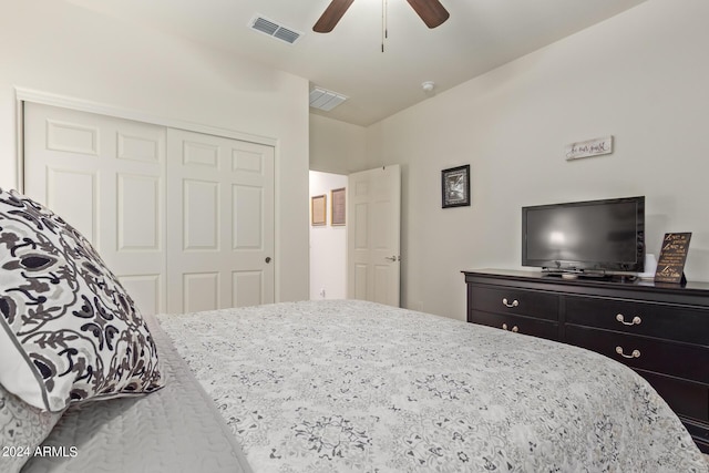 bedroom with ceiling fan and a closet