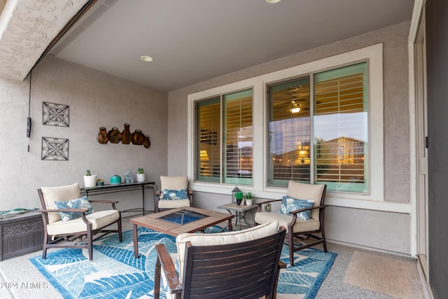 view of patio / terrace with an outdoor living space with a fire pit