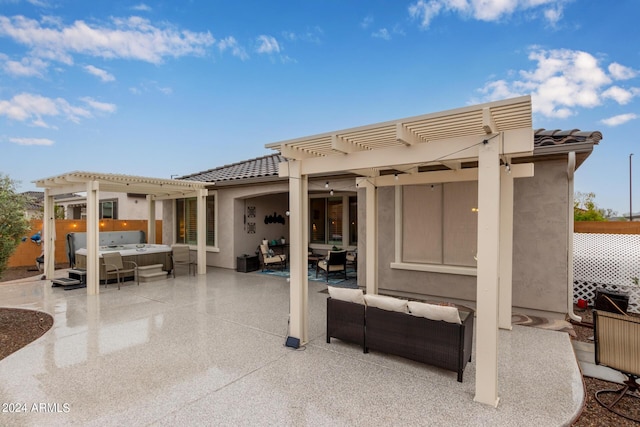 view of patio / terrace featuring a hot tub and a pergola