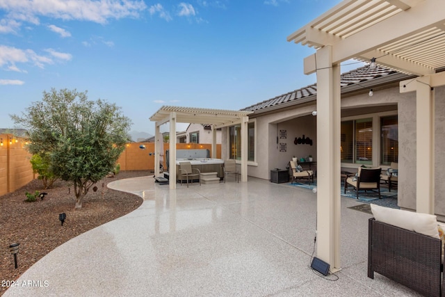 view of patio / terrace featuring a hot tub, outdoor lounge area, and a pergola