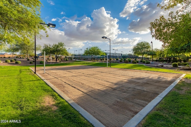 view of home's community featuring a lawn and volleyball court