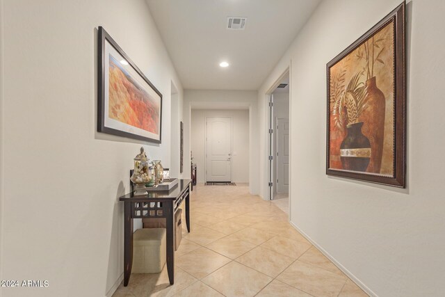 hallway featuring light tile patterned floors