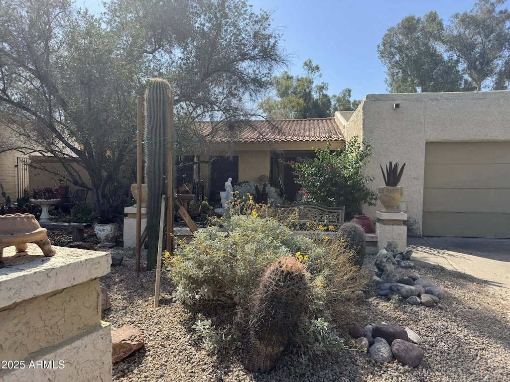 401 W Cape Royal Ln, Phoenix, AZ 85023 - view of front of house with stucco siding, a garage, and a tile roof