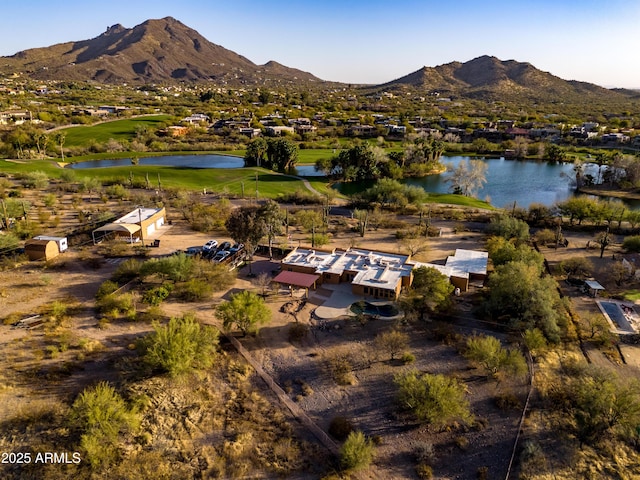 birds eye view of property featuring a water and mountain view