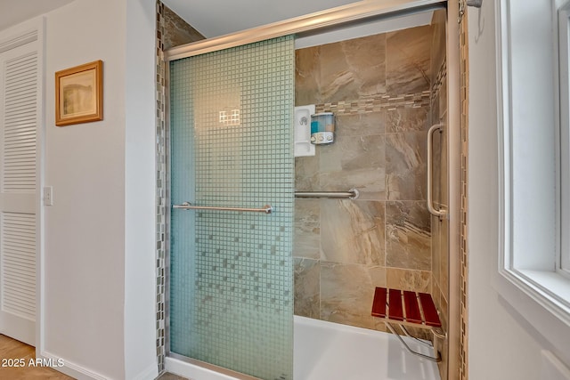 full bathroom featuring a bathtub and tiled shower