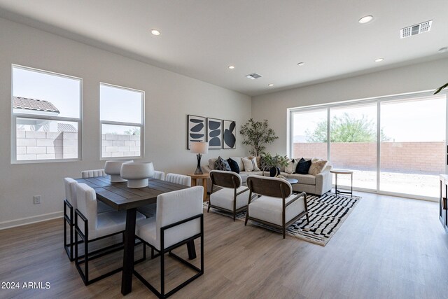 kitchen featuring gray cabinetry, sink, stainless steel range with gas cooktop, and light stone countertops