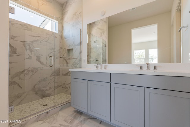 bathroom with vanity and an enclosed shower