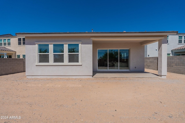 back of property featuring a patio area