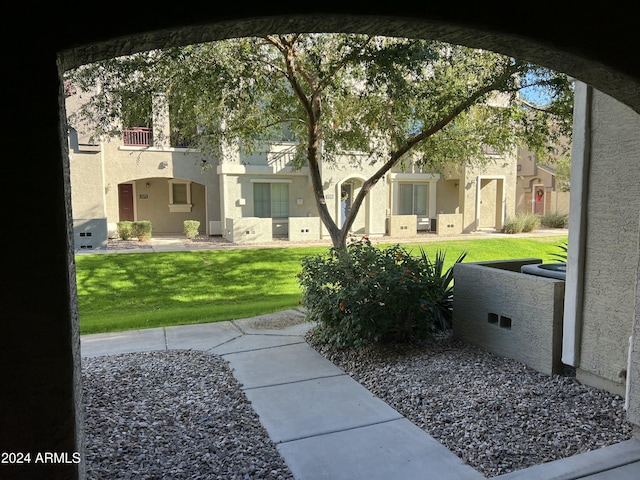 view of yard featuring a balcony