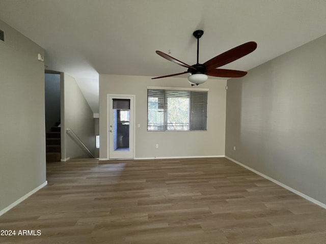 empty room featuring light wood-type flooring and ceiling fan