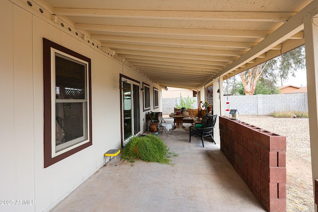 view of patio / terrace featuring fence