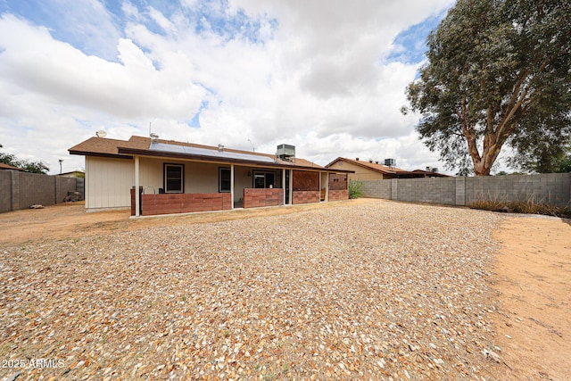 back of house featuring a fenced backyard and a patio area