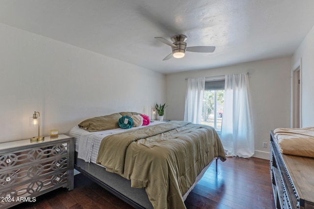 bedroom with ceiling fan and dark hardwood / wood-style floors