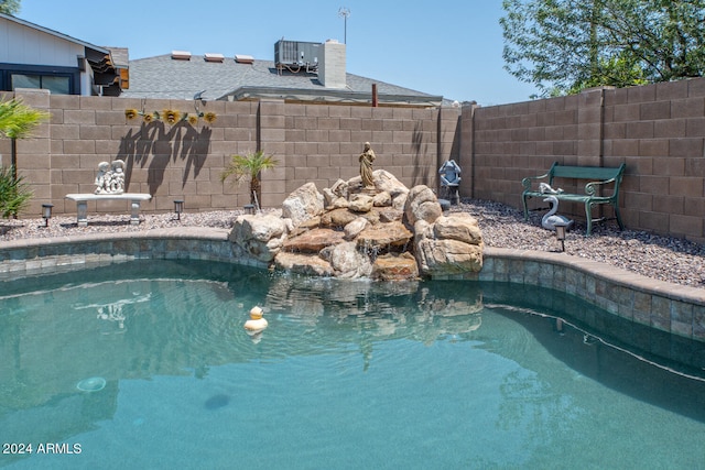 view of pool with central AC