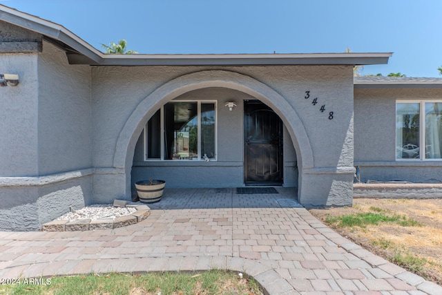 property entrance with a patio area