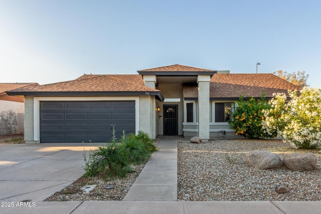 756 E Appaloosa Rd, Gilbert, AZ 85296 - view of front of home with an attached garage, concrete driveway, stucco siding, and a shingled roof